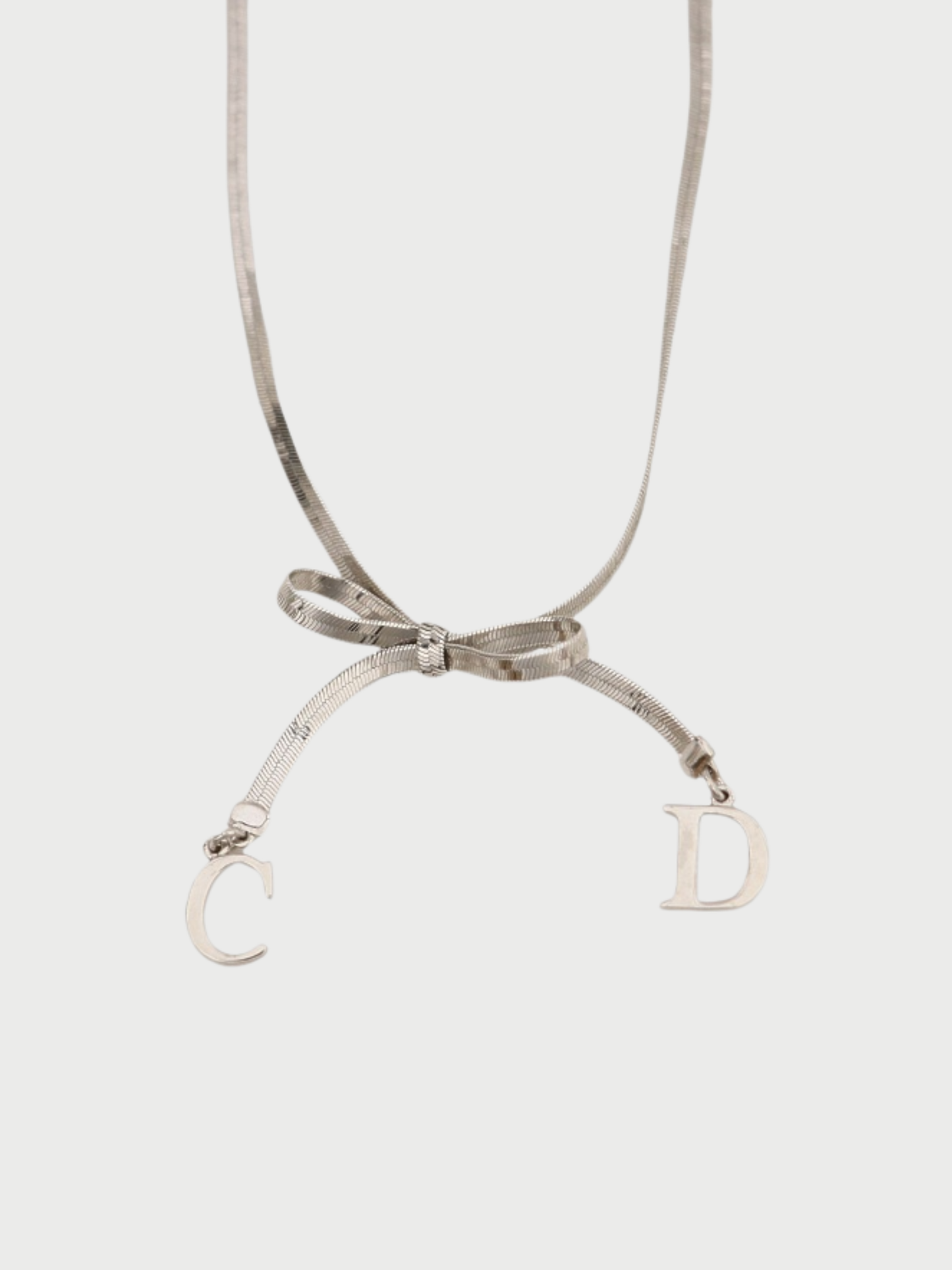 Christian Dior 2000s Silver Plated Metal CD Ribbon Necklace