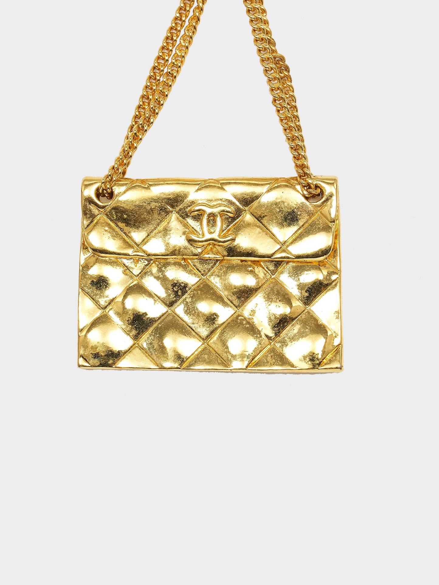 Chanel 1990s Gold CC Coin and Quilted Flap Brooch