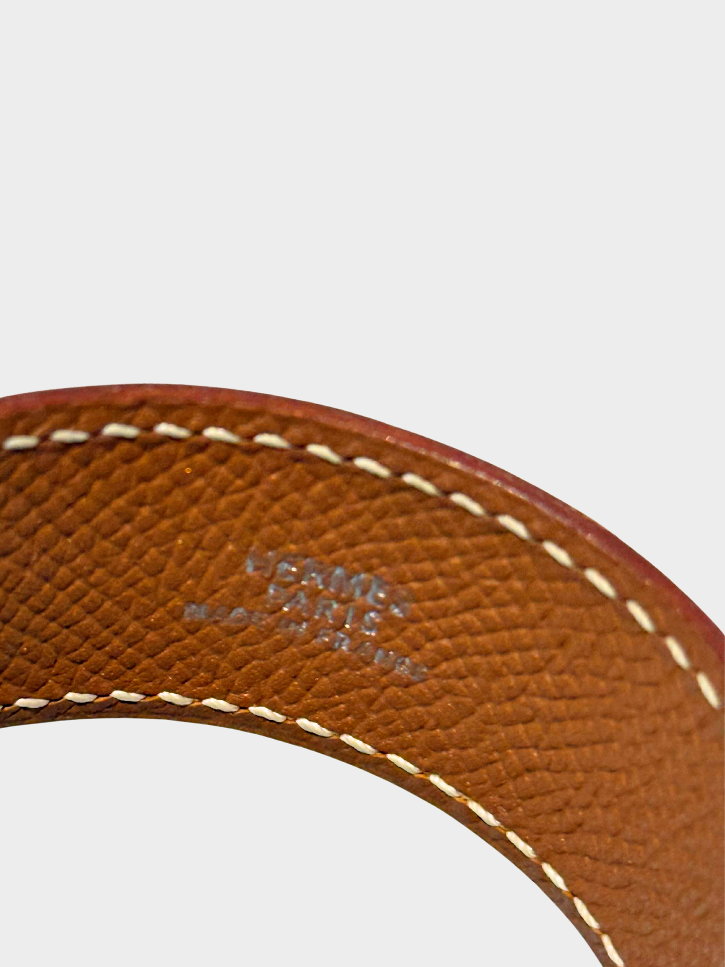 Hermès 2000s Gold Epsom Leather Sillage Cuff Bracelet