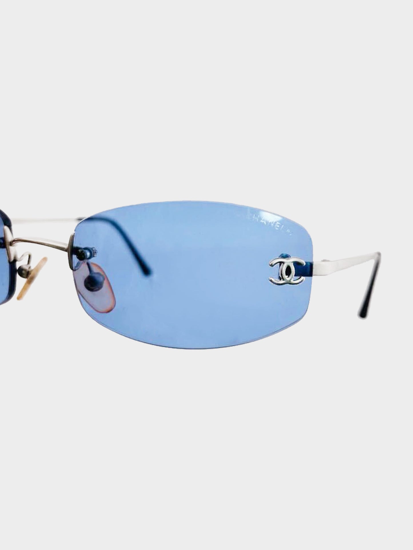 Chanel by Karl Lagerfeld 2000s Blue Tinted CC Logo Embellished Rimless Sunglasses
