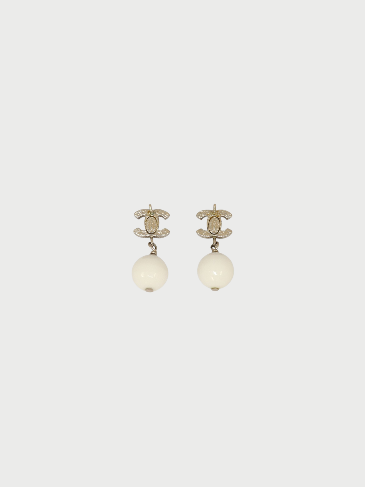 Chanel 2000s Silver White Plated Metal COCO Swing Earrings