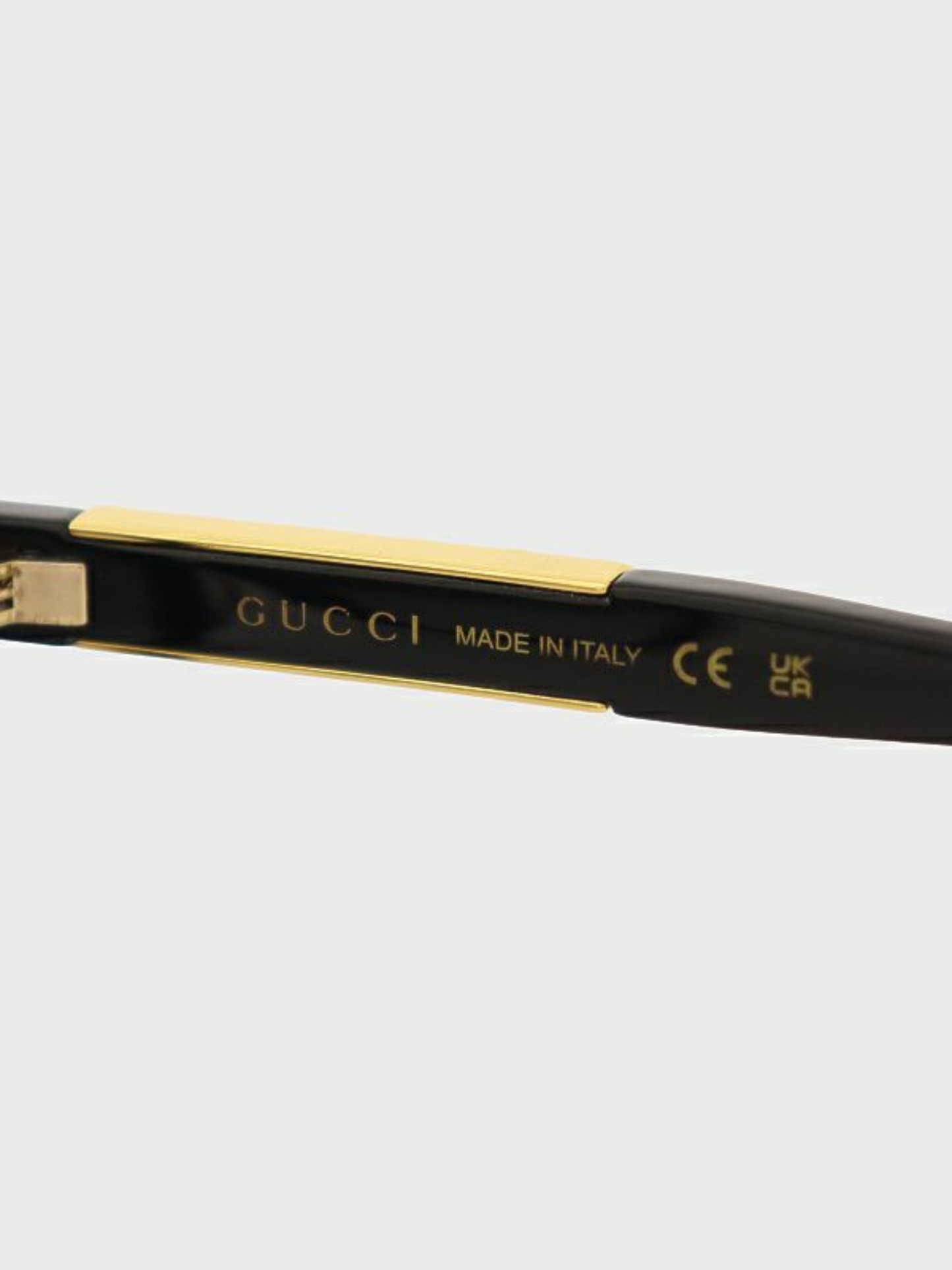 Gucci 2000s Black Gold Plastic Logo Sunglasses