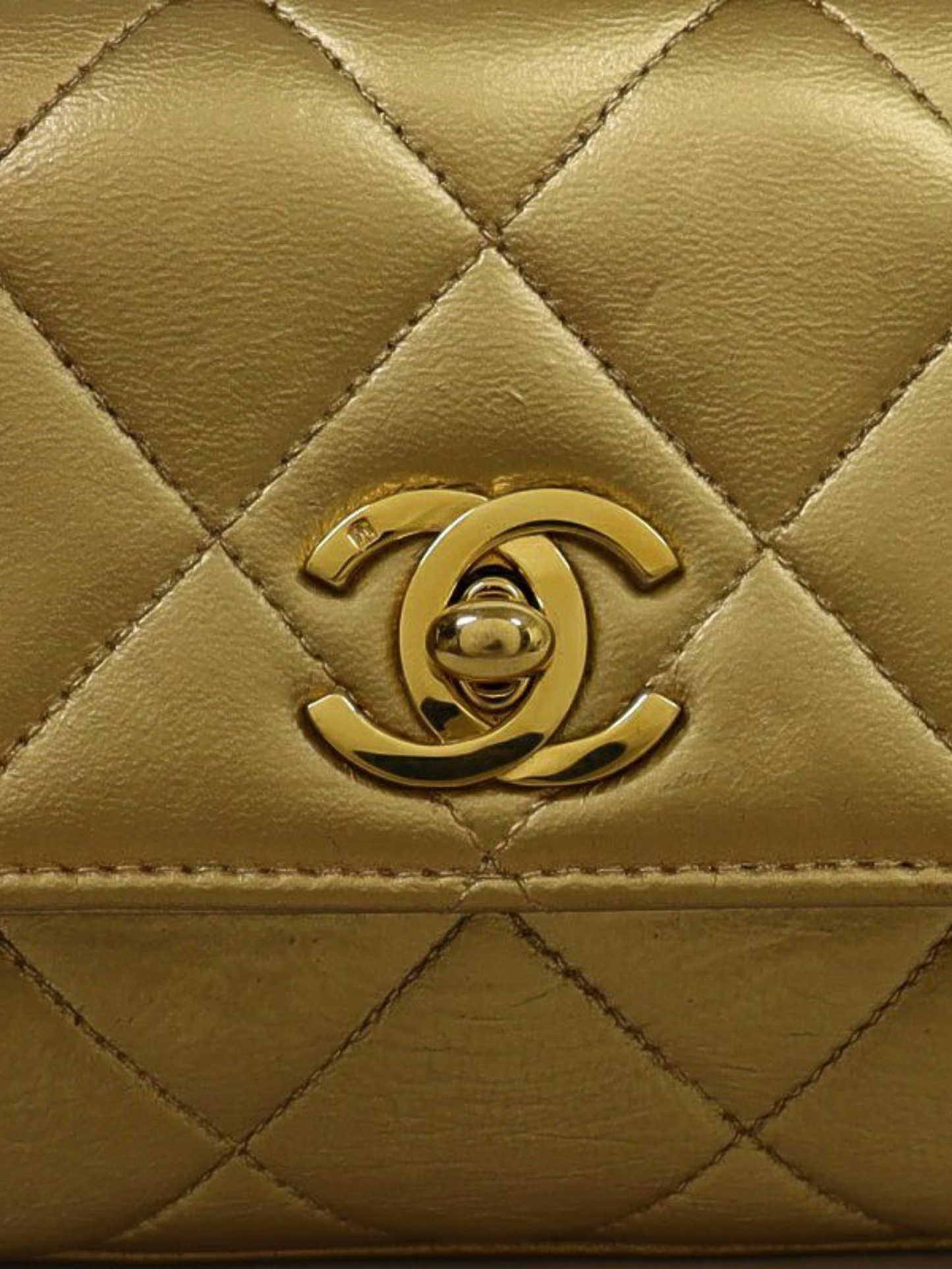 Chanel 1995–1996 Gold Leather Mini Matelassé Turn-Lock Chain Shoulder Bag