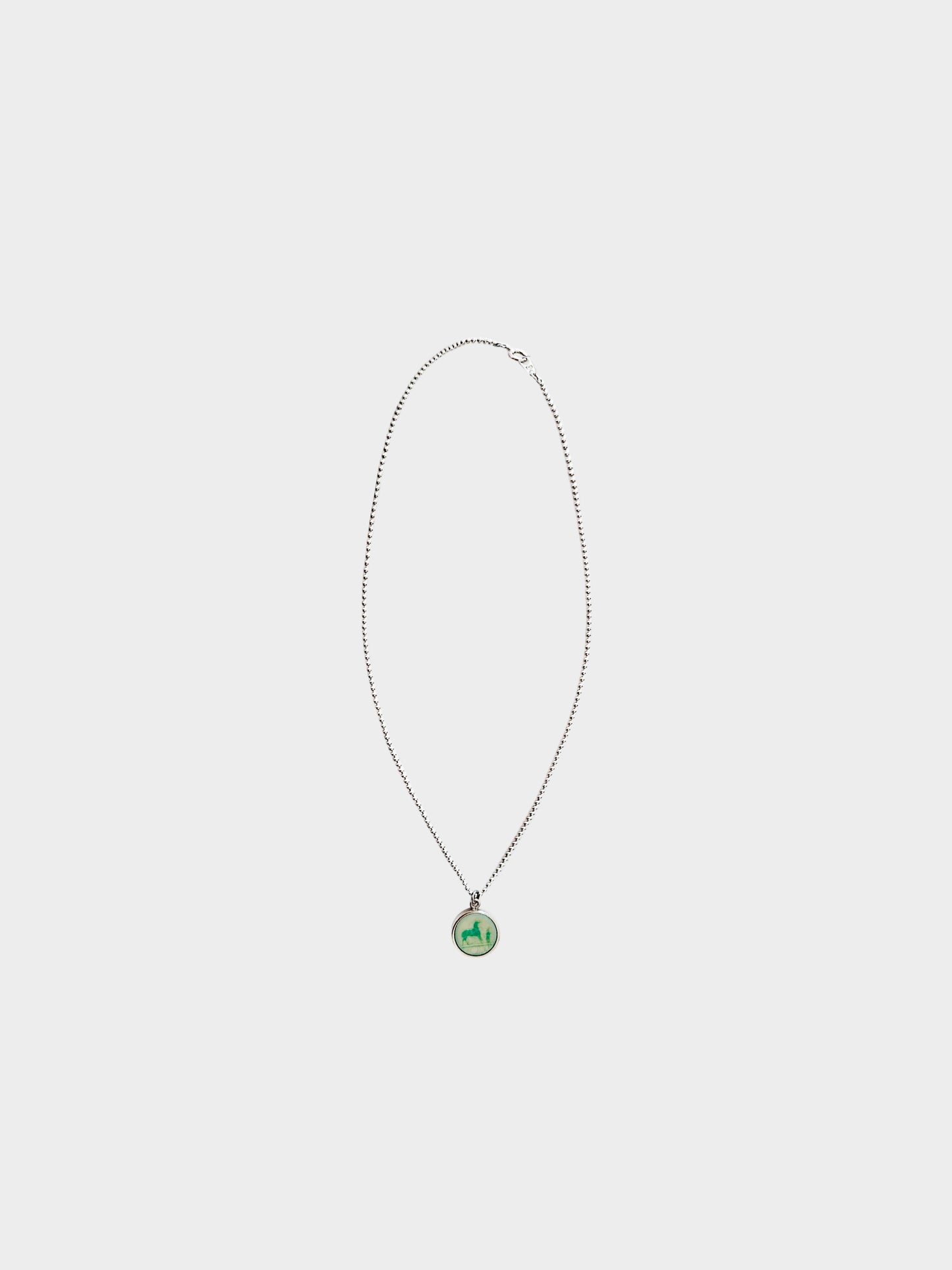 Hermès 1990s Silver and Green Corozo Horse Pendant Necklace