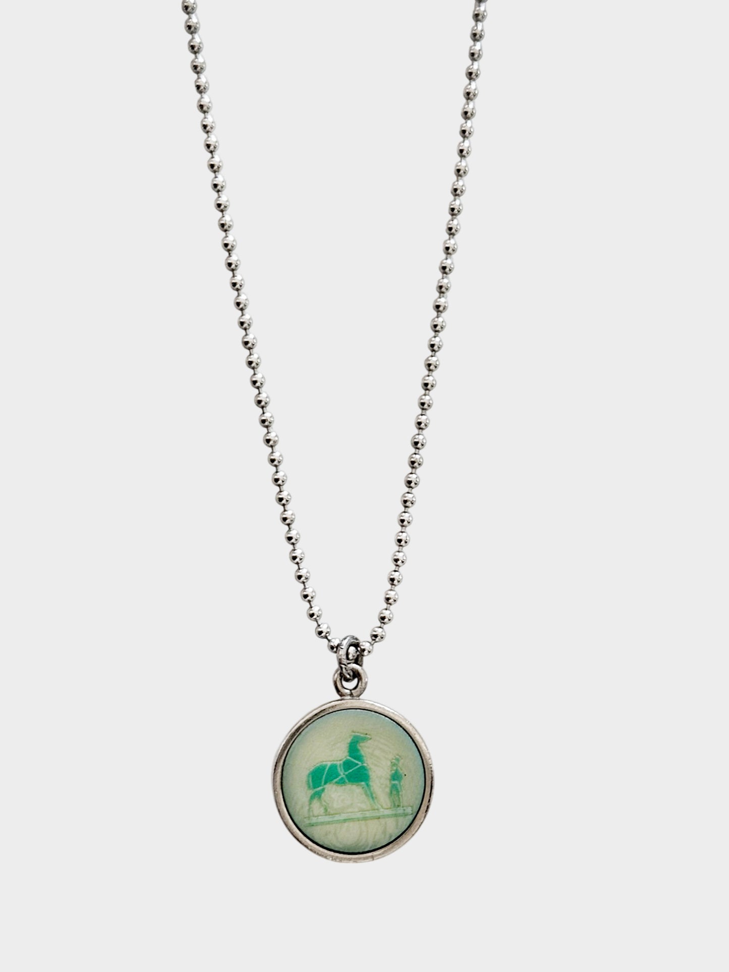 Hermès 1990s Silver and Green Corozo Horse Pendant Necklace