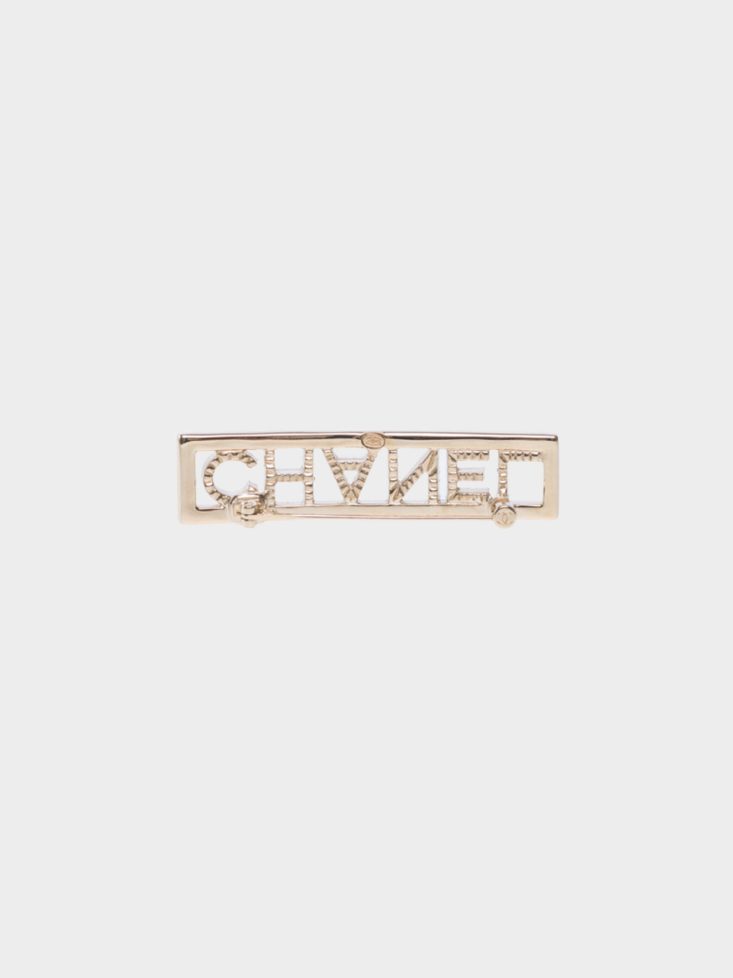 Chanel SS 2023 Gold Metal "CHANEL" Rhinestone Brooch